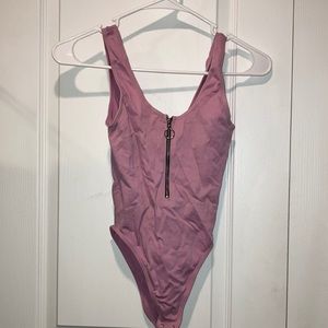 Pink body suit